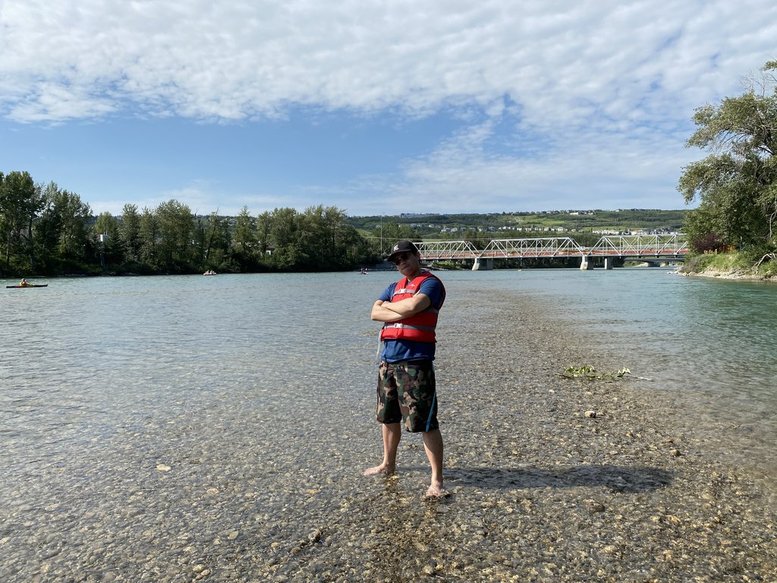 Standing in a shallow rocky area of the river