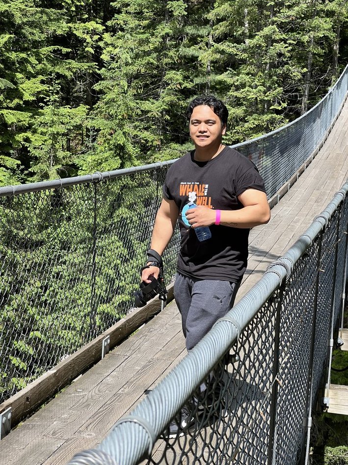 Mike walking the suspension bridge with his camera