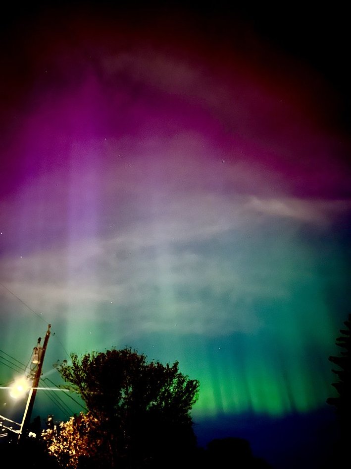 Vibrant purple and green aurora
