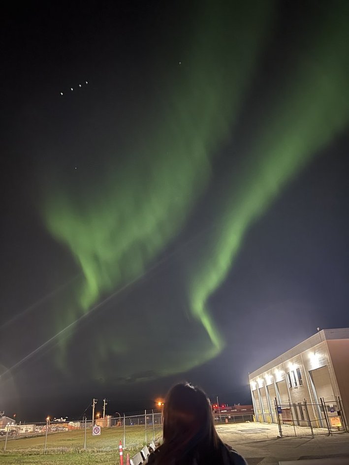 Aurora over a commercial building