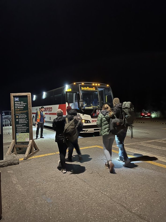 Boarding the alpine shuttle bus in the dark